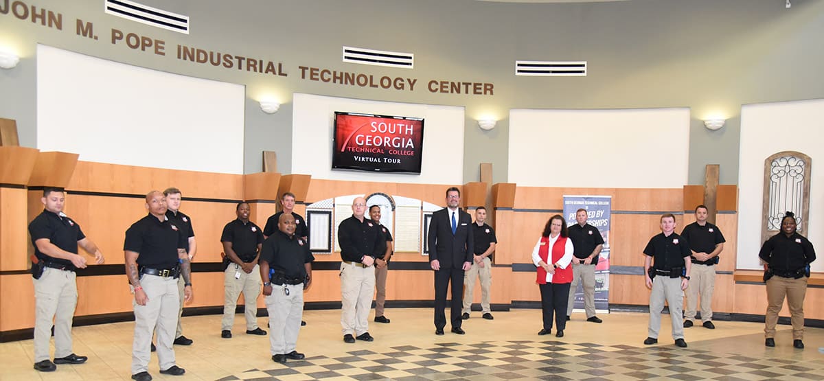 South Georgia Technical College President Dr. John Watford (front center), LEA Academy Director Brett Murray (front center left) and SGTC Assistant Vice President of Academic Affairs and LEA Academy Instructor Vanessa Wall (front center right) are shown above with the members of the South Georgia Technical College Law Enforcement Academy Class 20-02 cadets who competed their training recently. The cadets earned their POST certification and a technical certificate of credit for their course work in the academy. Shown above are: Logan Nathaniel Barrett, Brett Thomas Braxton, Jakob Thomas Hart, William Nicolas Page Leggett, Timothy Martin McKenna, Brandon Conner Ohm, Wesley Roshawd Poke, Tyrique Montavious Ridley, Courtney Lavette Seay, Trey Douglas Shipp, Eric Austin Taylor-Hair, and Stanley Jared Ward.