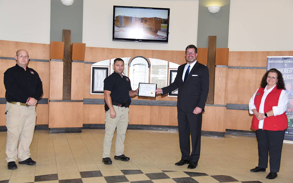 South Georgia Technical College Law Enforcement Academy Director Brett Murray is shown above (left) with Grayson H. Watson (center) of Sycamore, Georgia, who is a graduate of the South Georgia Technical College Law Enforcement Academy and a recipient of the SGTC Smallwood-Sondron Law Enforcement Scholarship. SGTC President Dr. John Watford (right) is also shown.