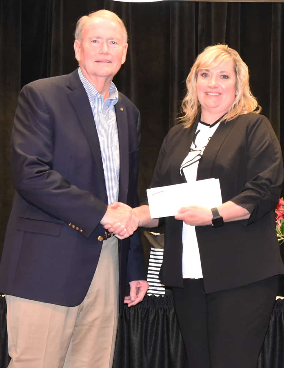 Americus Rotary Club Past President Don Smith (l) is shown above presenting a check from the Rotary Club to cosmetology student Dawn Ammons (r), who was selected as the SGTC 2021 GOAL student of the year.