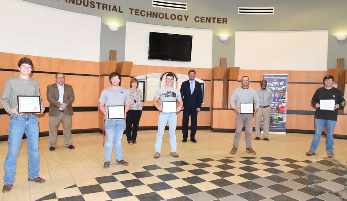 Shown above (l to r) on the front row are the five SGTC Electrical Lineworker students who earned scholarships from the South Georgia Tech Foundation. They are Garrett Earls of Macon with the Georgia EMC Foreman and Supervisors Scholarship; Mason Andrew Kirkpatrick of Cochran with the Georgia Power Scholarship; Justin Gabriel Densel of Salem, AL, with the Kyle Glenn Holcomb scholarship; Owen Deal of Leesburg with the Sumter EMC Foundation scholarship; and Witt Brown of Montezuma with the Chattahoochee Flint RESA scholarship. On the back row are SGTC’s Business and Industry Services Director Paul Farr, Economic Development Assistant Tami Blount who works with the SGTC Electrical Lineworker program, President Dr. John Watford and Lineworker Instructor Sidney Johnson.