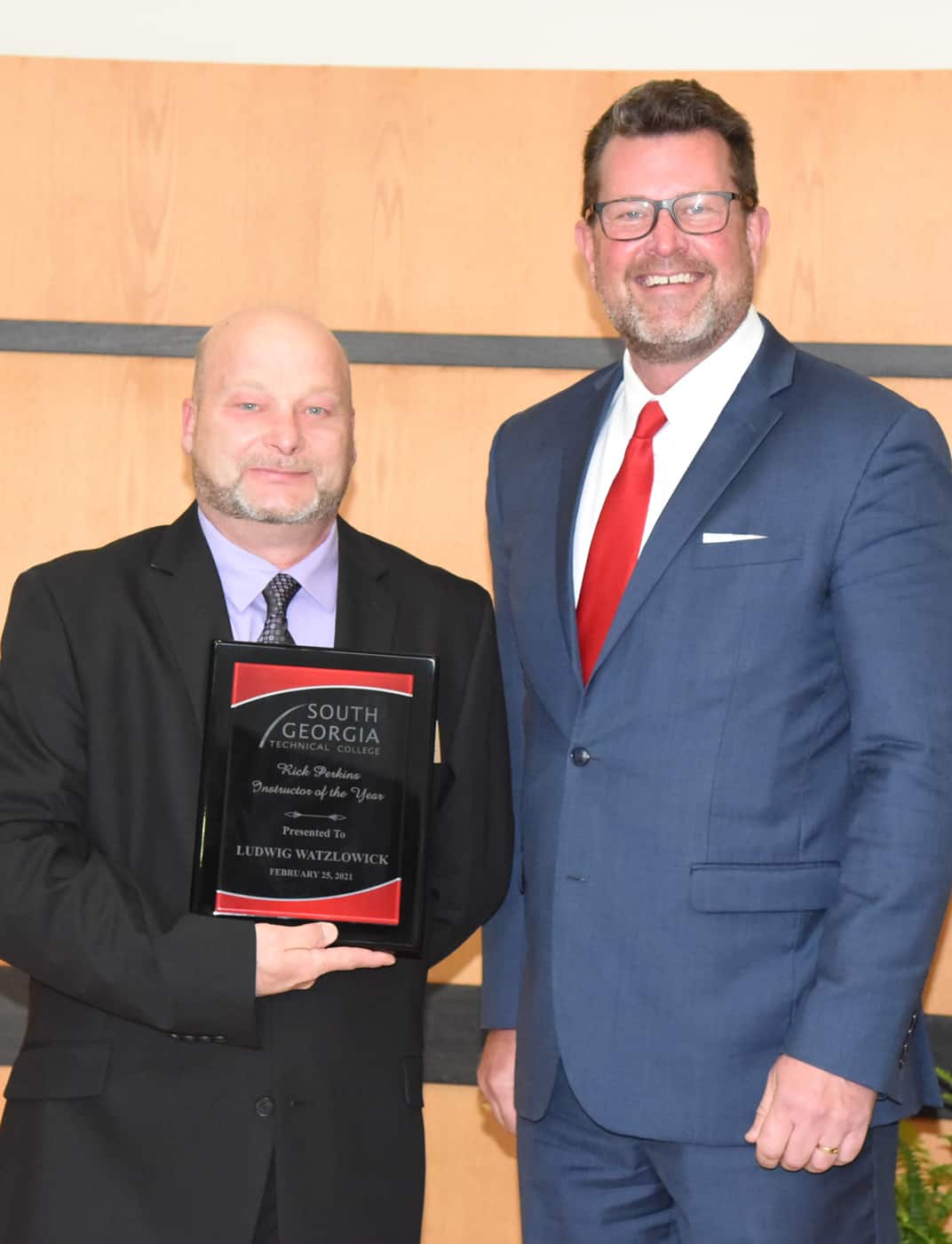 SGTC President Dr. John Watford (right) is shown above presenting culinary arts instructor Ludwig “Chef Ricky” Watzlowick (left) with the SGTC Instructor of the Year award for 2021.
