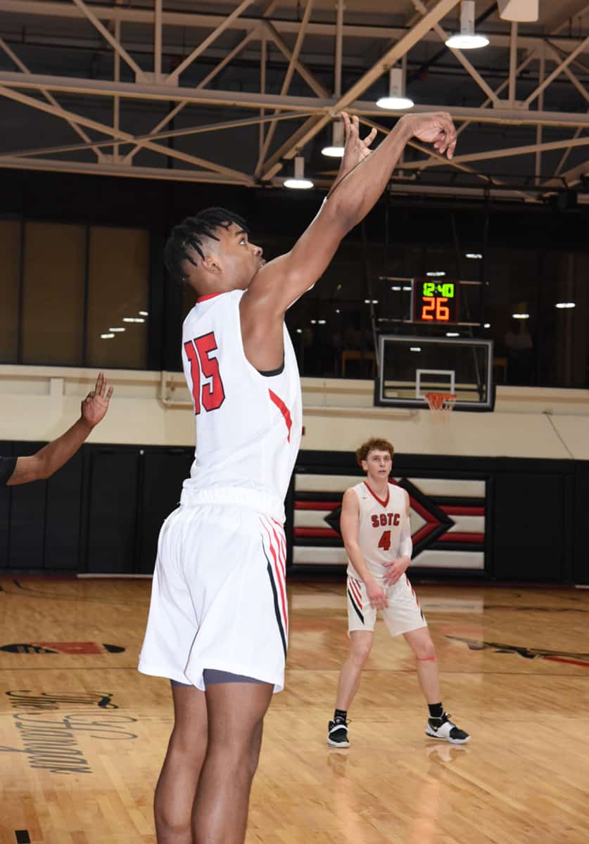 Jordan Stephens (15) hit a three point shot in the second over-time to help lift the Jets to an 85 – 81 GCAA win over South Crescent Technical College.
