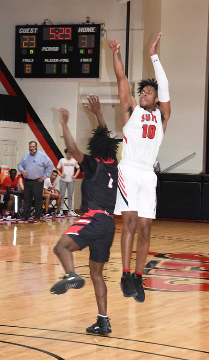 Marvin McGhee (10) led his team to victory over the Albany Tech Titans with 25 points and 10 rebounds.