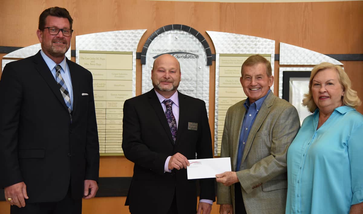 South Georgia Technical College President Dr. John Watford (l to r) is shown with the SGTC 2021 Instructor of the Year Chef Ricky Ludwig Watzlowick and President Emeritus Sparky Reeves and Allene as they are presenting Watzlowick with a check for being named SGTC 2021 Instructor of the Year.