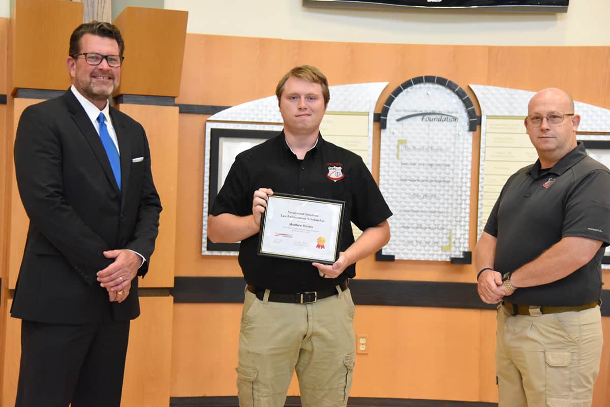 South Georgia Technical College President Dr. John Watford (left) is shown above congratulating Matthew Perrine (center) for receiving the Smallwood – Sondron Law Enforcement Academy Scholarship. SGTC Law Enforcement Academy Director Brett Murray is also shown above (right).