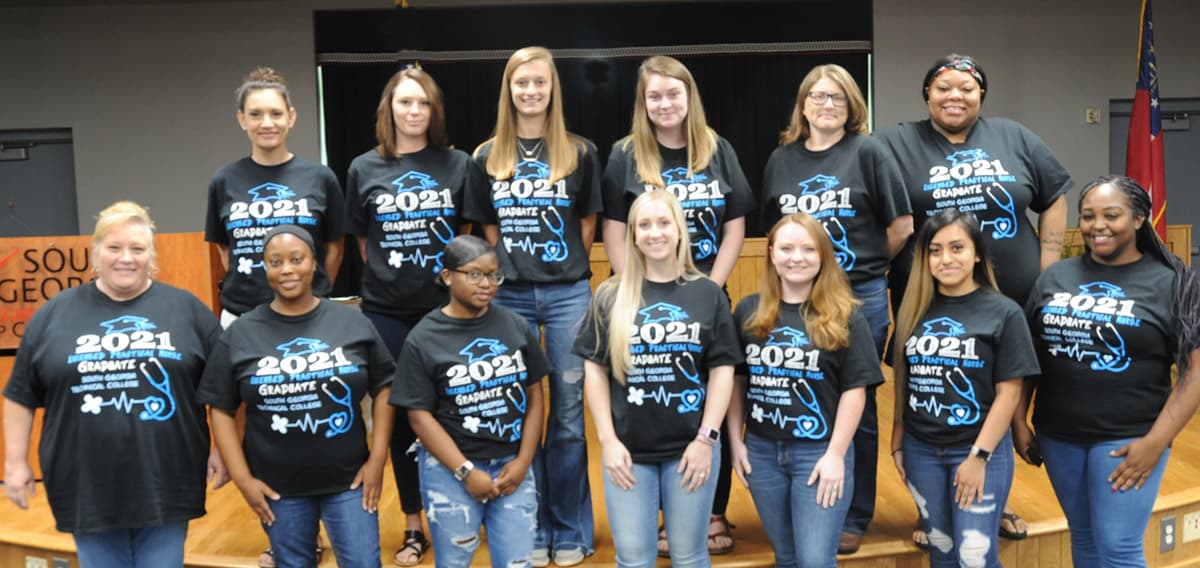 Shown above are the SGTC Crisp County Center 2021 Practical Nursing graduates displaying the t-shirts presented to them by their instructor Brandy Nipper. Shown (l to r) on the bottom row are: Valarie Lamb, Shaybrielle Mallory, Terica Peterson, Maggie Bloodworth, Jasmine Alexander, Ana Bartolog and Taleisha Kinder. On the top row are: Jessica James Jennifer Sparrow, Bailey Manning, Katelyn Peacock, Lisa Fultz, and Syrrell Ruff.