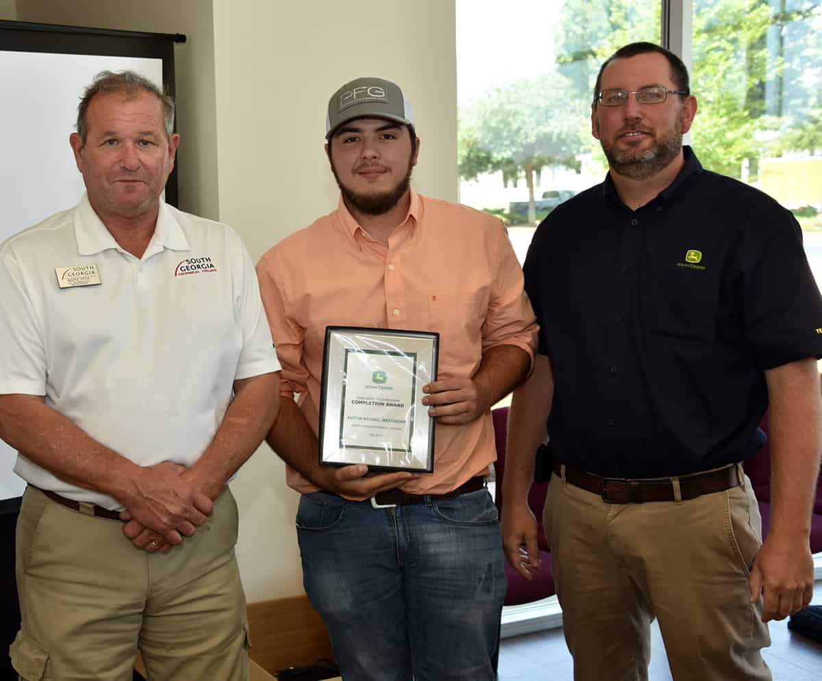 SGTC John Deere Agricultural Technology graduate Austin Westbook (middle) is shown above with SGTC instructors Wayne Peck and Mathew Burks. Westbook was featured in a podcast recently talking about life as a John Deere technician.