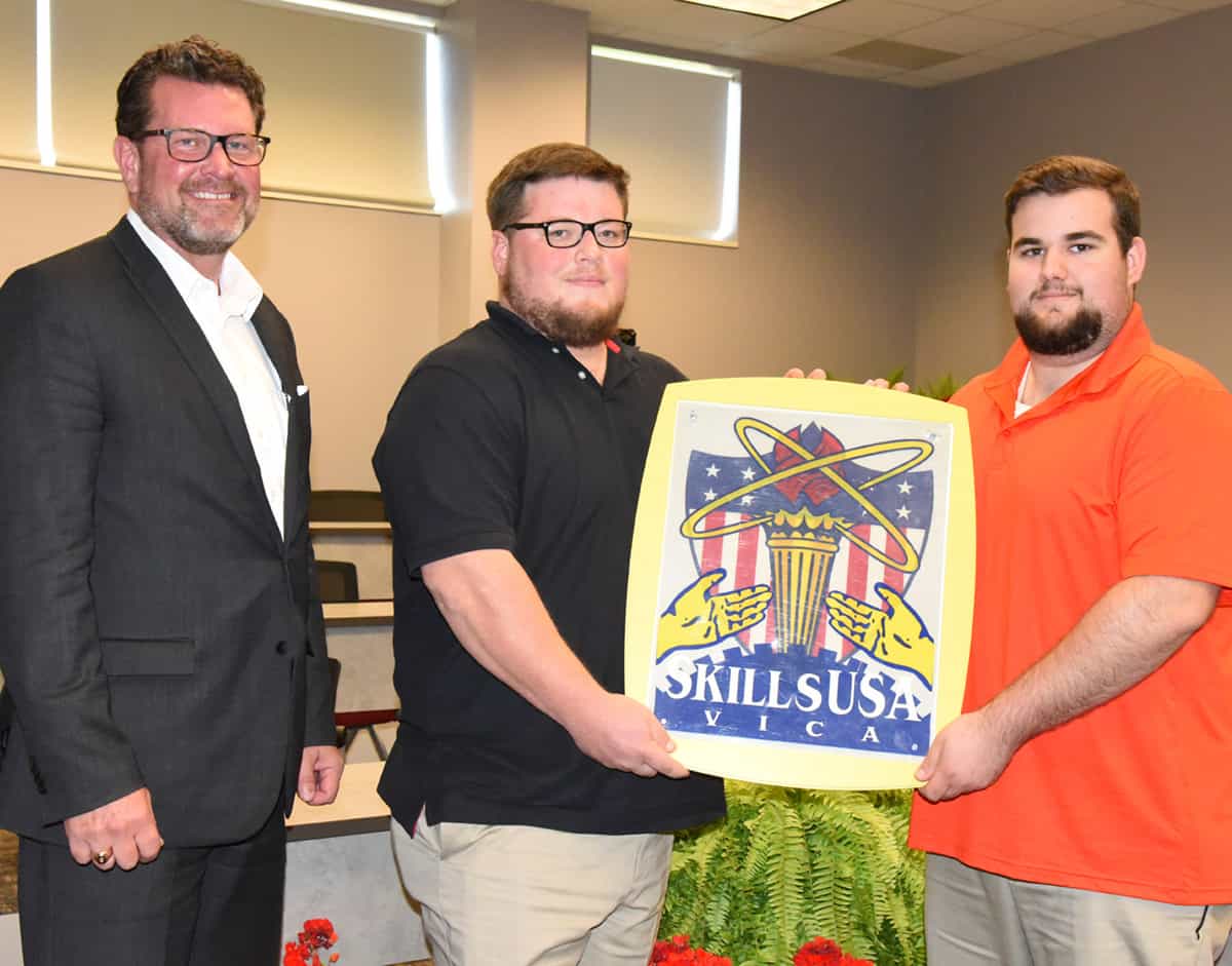 : South Georgia Technical College President Dr. John Watford (l to r) is shown above congratulating Patrick Hortman of Ellaville and Tison Smith of Leesburg on their award-winning national performance in the SkillsUSA additive manufacturing competition that earned them scholarships from SME and Stratasys.