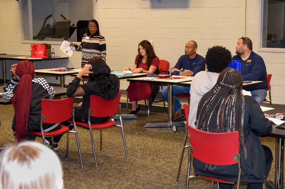 SGTC Director of Career Services Cynthia Carter (standing) addresses students at a recent workshop on career development. Seated (l-r) are guest speakers Nichole Adams, Kawain Reese, and Chris Walker.