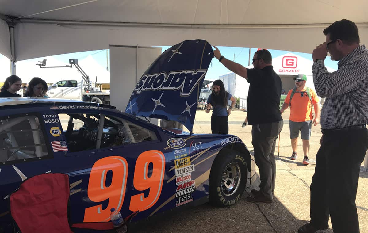 South Georgia Technical College President Dr. John Watford (right) is shown above with a group of interested students who are checking out the college’s #99 Aarons Rents Race Car, which was on exhibit at the Ag Expo.