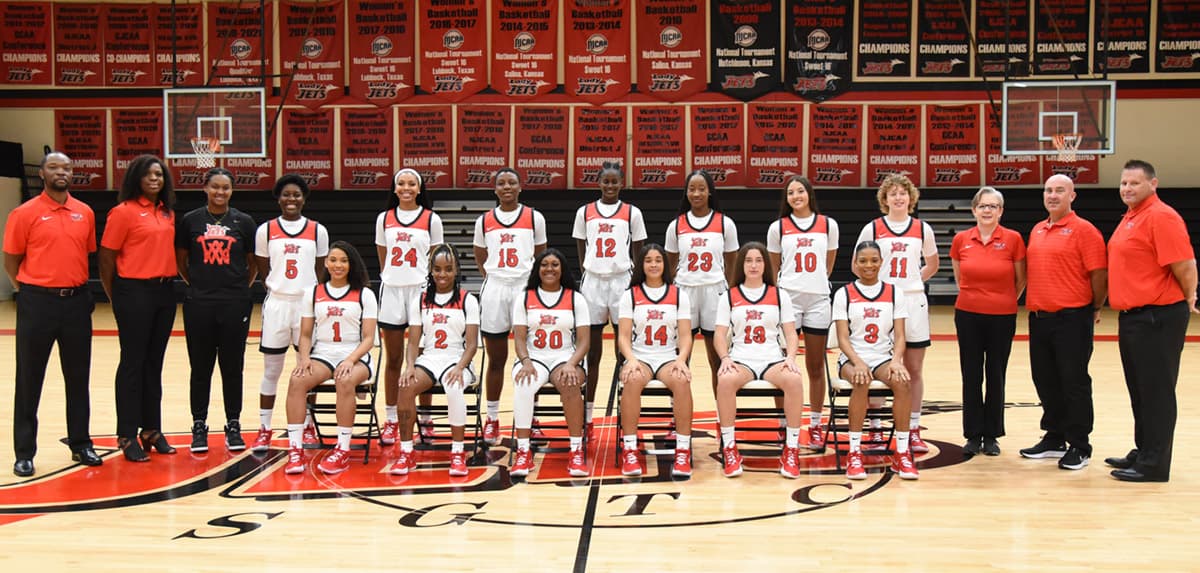 Coach James Frey and the 2021 – 2022 Lady Jets ranked 9th in pre-season poll and will play a scrimmage game against Albany State University on Tuesday, October 26th in the Hangar on the SGTC Americus campus. In the photo (seated l to r) are: Luana Leite, 1; Maikya Simmons, 2; Kamya Hollingshed, 30; Laurie Calixte, 14; Cintia Lopez-Bevia, 13; and Majomary John Ubi, 3. Standing (l to r) are: Assistant Coaches Demetrius Colston and Adenike Aderinto, team manager Cania Dawson, and players Alexia Dizeko, 5; Camryn James, 24; Tena Ikidi, 15; Mame Thiaw, 12; Fanta Dansokho, 23; Susana Posada, 10; and Loes Rozing, 11; along with Athletic Activities Coordinator Terri Battle, Trainer Brian Davis, and Head Coach James Frey.
