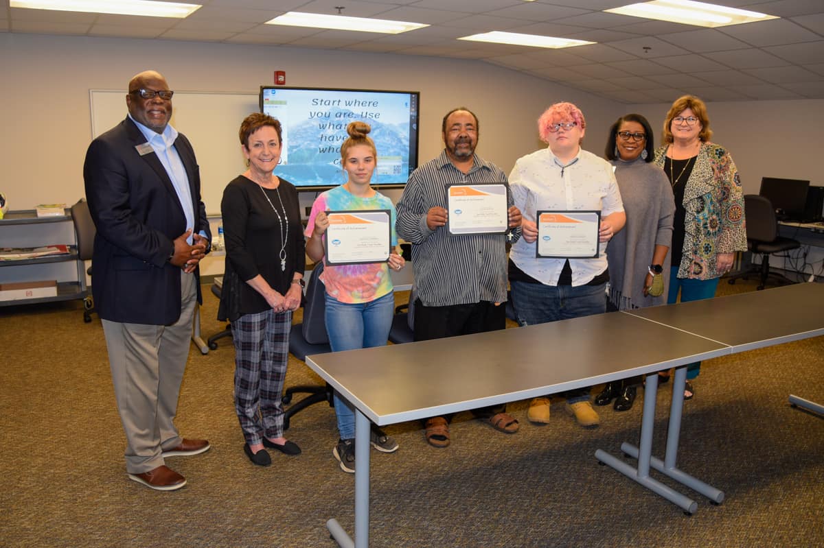 Pictured (l-r) are Al Harris, Lillie Ann Winn, Allie Zipperer, Calvin Santos, Monica Barnes, Cynthia Carter, and Tracy Israel as Zipperer, Santos, and Barnes were recognized for completing the Safety First IET course.