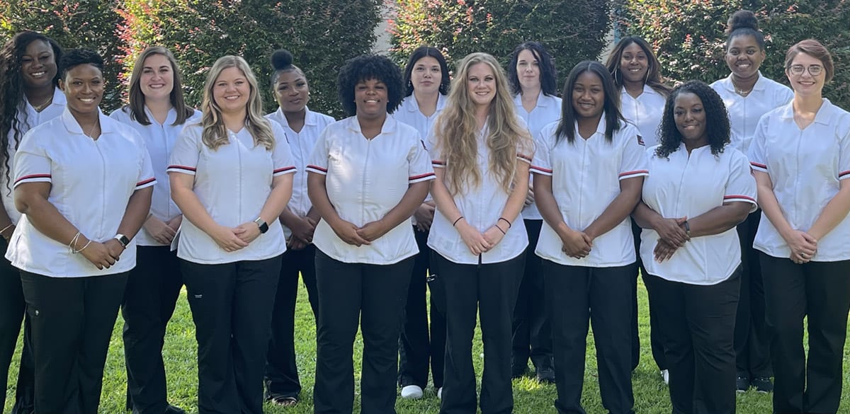 Shown above are the South Georgia Technical College Americus 2021 Practical Nursing graduates. Jennifer Childs and Christine Rundle are the SGTC Americus practical nursing instructors. Shown (l to r) on the back row are: Jasmin Robinson, Jordan Mizell, Zikerria Burton, Elizabeth Guerrero, Brittany Martinez, Cassandra Henderson, and Sonica Burton. On the front row (l to r) are Niki Banks, Shelby Law, Kambi Gardner, Kori Holley, Sontia Ingram, Elbunie Smith, and Ashley Ginn.