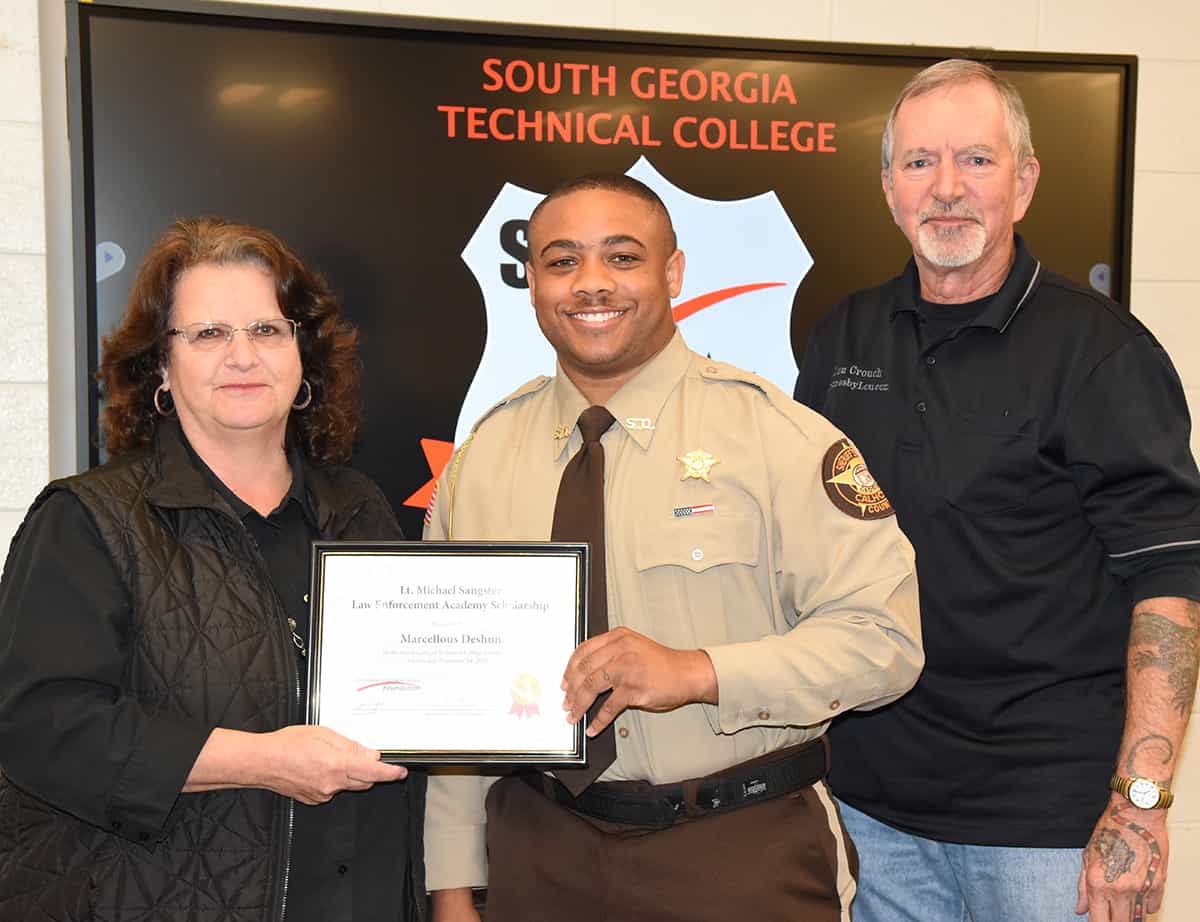 South Georgia Technical College Assistant Vice President of Student Affairs and Law Enforcement Academy instructor Chief Vanessa Wall is shown above presenting the Lt. Michael Sangster Law Enforcement Academy Scholarship to Marcellous Deshun. Lou Crouch is also shown helping with the presentation.