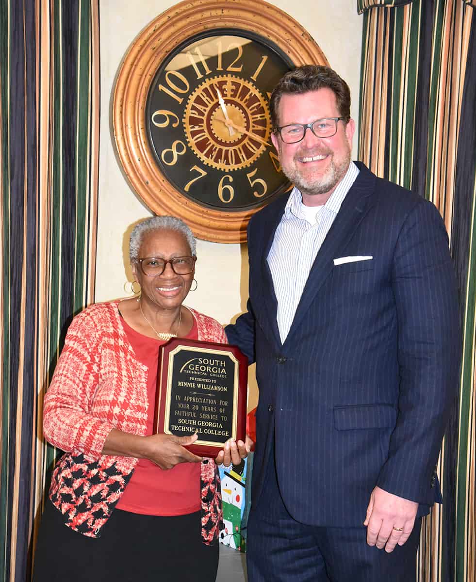 SGTC President Dr. John Watford (right) is shown above presenting Minnie Williams (left) with a retirement plaque for over 20 years of service to the students at South Georgia Technical College.