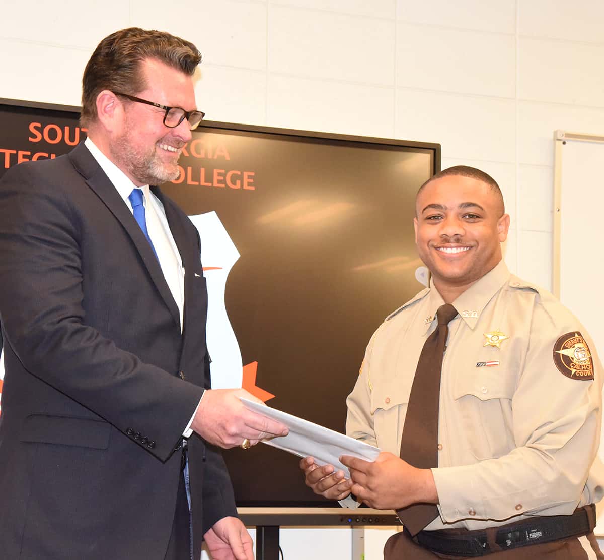 Dr. Watford is shown above with Cadet Marcellous Deshun who was named as the LEA Class 21-02 Class Representative and Top Gun award winner. He also received the Chief Vanessa Wall Criminal Justice/Law Enforcement Academy initial scholarship and the Lt. Michael Sangster Scholarship.