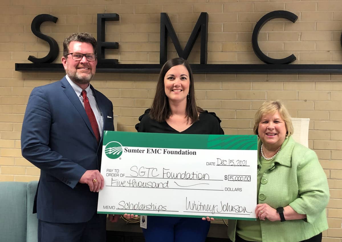 South Georgia Technical College President Dr. John Watford (l) and SGTC Vice President of Institutional Advancement and Executive Director of the SGTC Foundation, Su Ann Bird (r), is shown above accepting the Sumter EMC Foundation check from Sumter EMC’s Whitney Johnson for an endowed scholarship at South Georgia Technical College.
