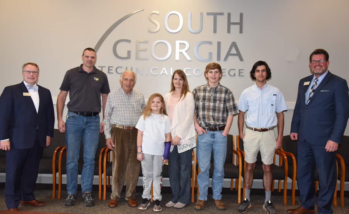 South Georgia Technical College President Dr. John Watford (right) is shown above with former Georgia Department of Technical and Adult Education Chairman Dan Rather and his guests from Morgan County. Shown (l to r) are SGTC Vice President of Academic Affairs David Kuipers, Mike Williams of John Deere Ag Pro, Dan Rather, Brynlee Dickerson, Laurie Dickerson, Brayden Dickerson, Mike Dowd, and Dr. Watford.