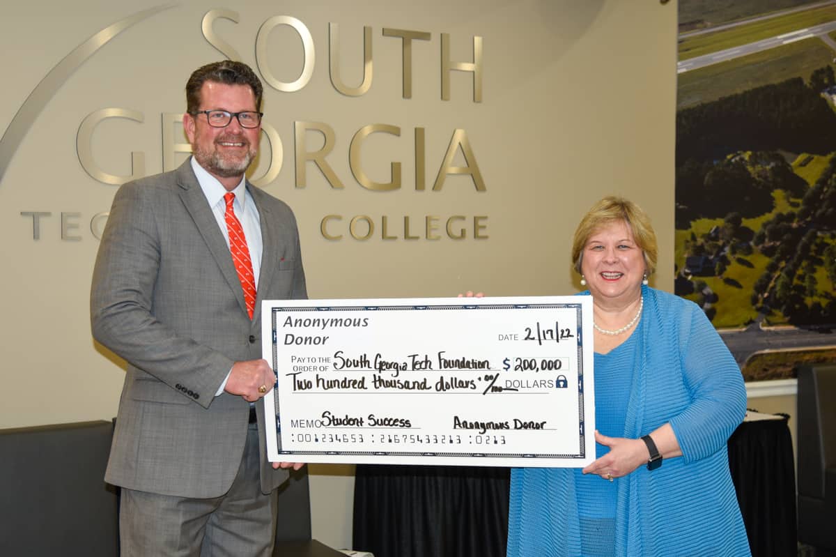 South Georgia Technical College President Dr. John Watford and SGTC Vice President of Institutional Advancement and Executive Director of the SGTC Foundation are shown above with a big check simulating the $200,000 donation from an anonymous donor to the Foundation designed to help change the lives of South Georgia Tech students.
