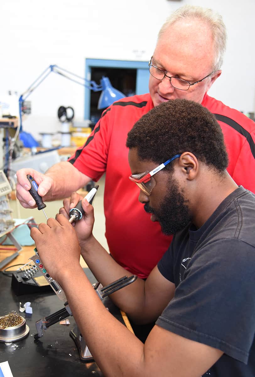 South Georgia Technical College Aviation Maintenance and Avionics instructor Charles Christmas is shown above with an avionics student working in the Griffin Bell Aeronautic Center avionics lab learning more about Aviation Maintenance and Avionics.