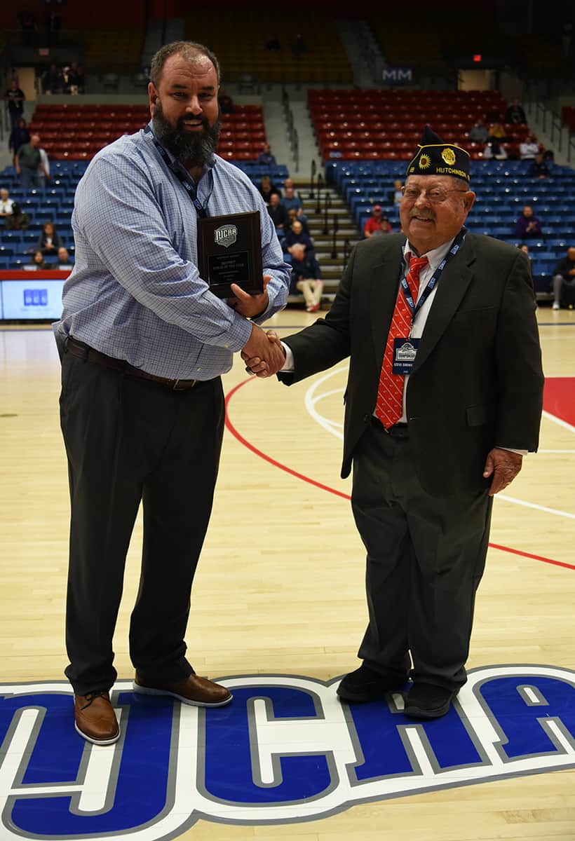 Steve Showalter of the Hutchinson American Legion and team host for the Jets, is shown above (right) presenting SGTC’s Chris Ballauer with the NJCAA Southeast District Coach of the Year award prior to the Jets – South Plains game.
