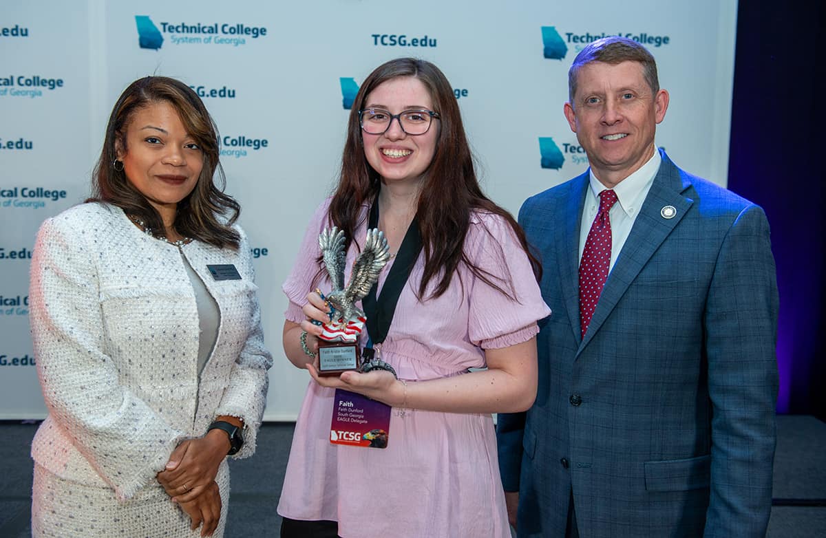SGTC EAGLE Student Faith Dunford (center) with TCSG Commissioner Greg Dozier and TCSG Assistant Commissioner for Adult Education Dr. Cayanna Good at the TCSG Dinah Culbreath Wayne EAGLE conference.