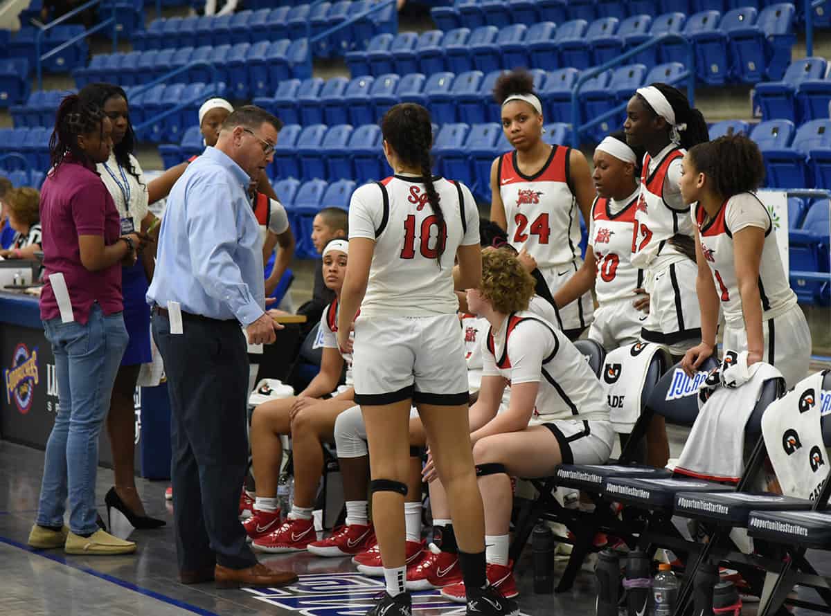 South Georgia Technical College Lady Jets head coach James Frey is shown above talking with his team during a time out.