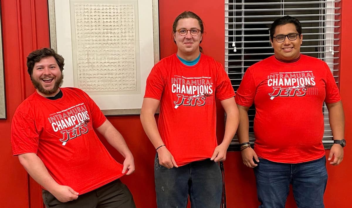 SGTC Super Smash Bros. intramural tournament champions Jason Simon-Pena and Zach Draper are shown above with their SGTC Intramural Champions t-shirts. Jacob Groesch, finalist, is also shown in a t-shirt.