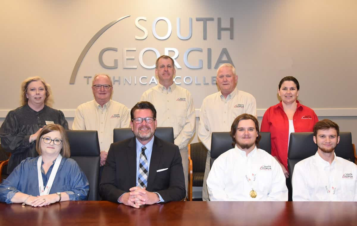 South Georgia Technical College President Dr. John Watford (seated second from left) is shown above with the SGTC Georgia SkillsUSA medal winners. They are (seated left to right) Kimberly Sadecky, Gold winner in Job Skills Interview; Jonathan Large, Gold winner in Aviation Maintenance Technology, and Carson Innarino, Silver winner in Aviation Maintenance Technology. Shown on the back row are instructors who nominated the students and helped prepare them for the competitions. They are SGTC Americus Criminal Justice Instructor Teresa McCook, Aviation Maintenance Instructors Charles Christmas, Paul Pearson, David Grant, and Victoria Herron.