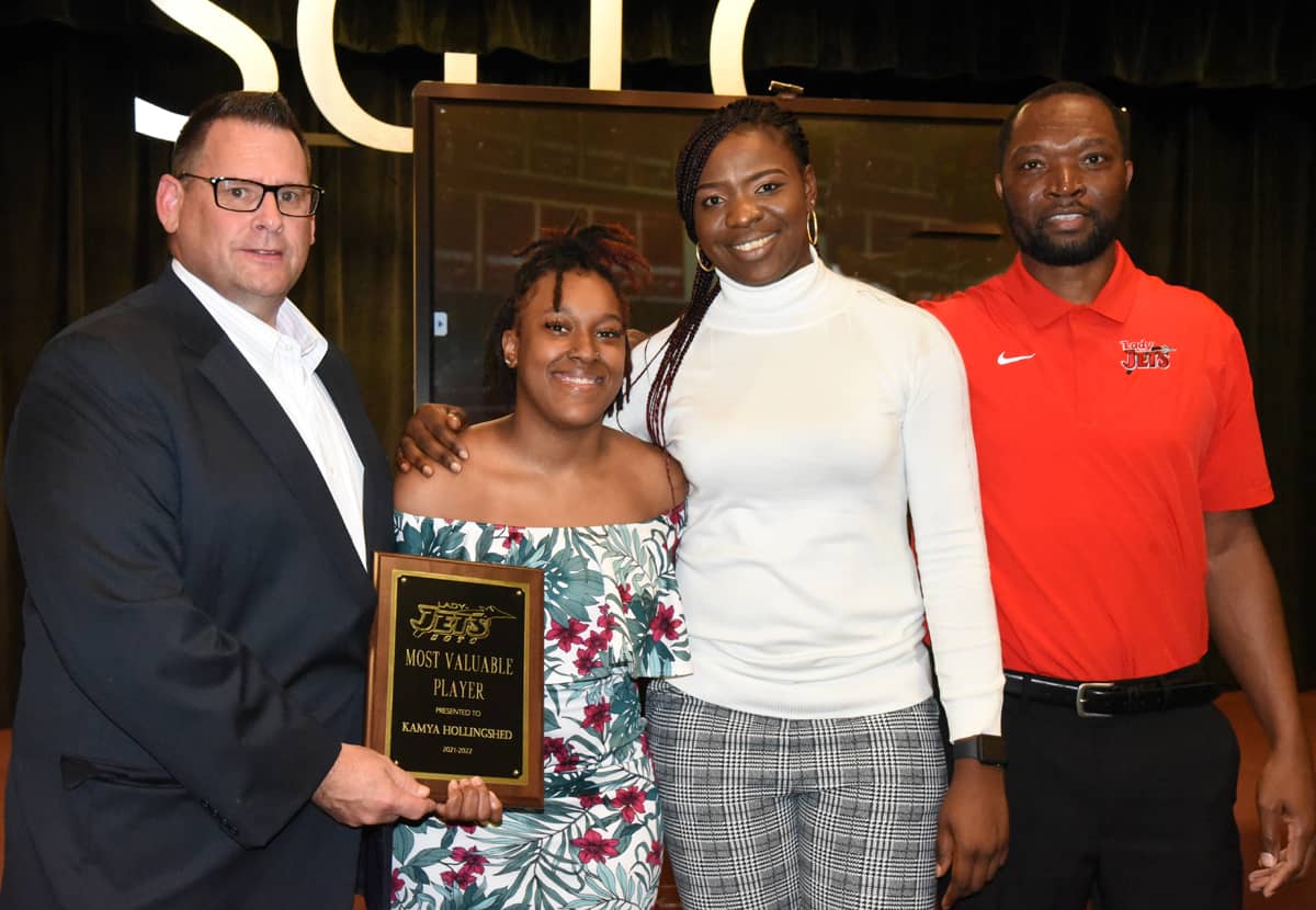 SGTC Athletic Director James Frey (l to r) is shown above presenting the Lady Jets MVP Award to Kamya Hollingshed with assistant coaches Adenike Aderinto and Demetrius Colson looking on.