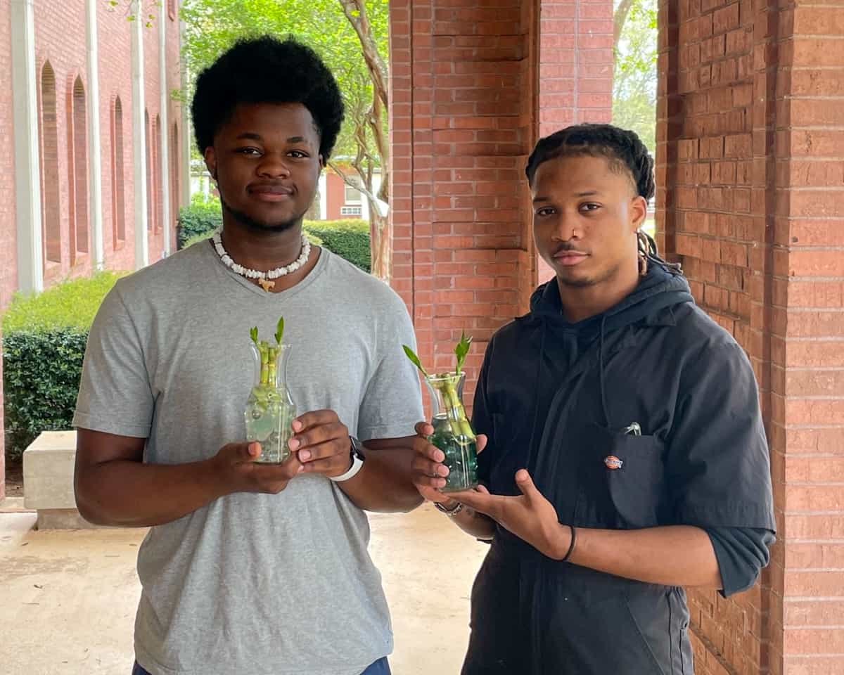 SGTC Motorsports Vehicle Technology students Detrontae Daniels of Lithonia and Tyquillious Mohone of Eatonton show off the “lucky bamboo” displays they created in an activity sponsored by the SGTC Office of Student Affairs to commemorate National Gardening Day.