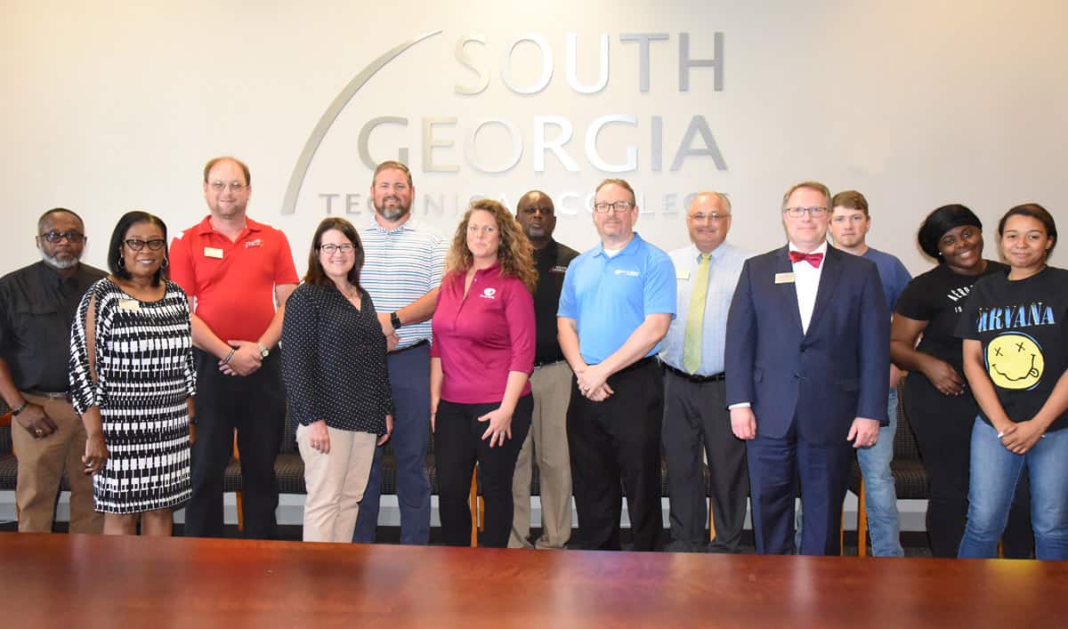 South Georgia Technical College Director of Career Services Cynthia Carter is shown above on the front row with Blue Bird Senior SR Business Partner Stephanie Thompson, Recruiting Manager Ashley Mixon, and Director of Training Robert Jason Carrigan along with SGTC Vice President of Academic Affairs David Kuipers. Shown on the back row are: SGTC Air Conditioning Technology Instructor Johnny Griffin, Aircraft Structural Instructor Jason Wisham, Precision Machining and Manufacturing Instructor Chad Brown, Auto Collision and Repair Instructor Starlin Sampson, Academic Dean Dr. David Finley, and three Aircraft Structural students.