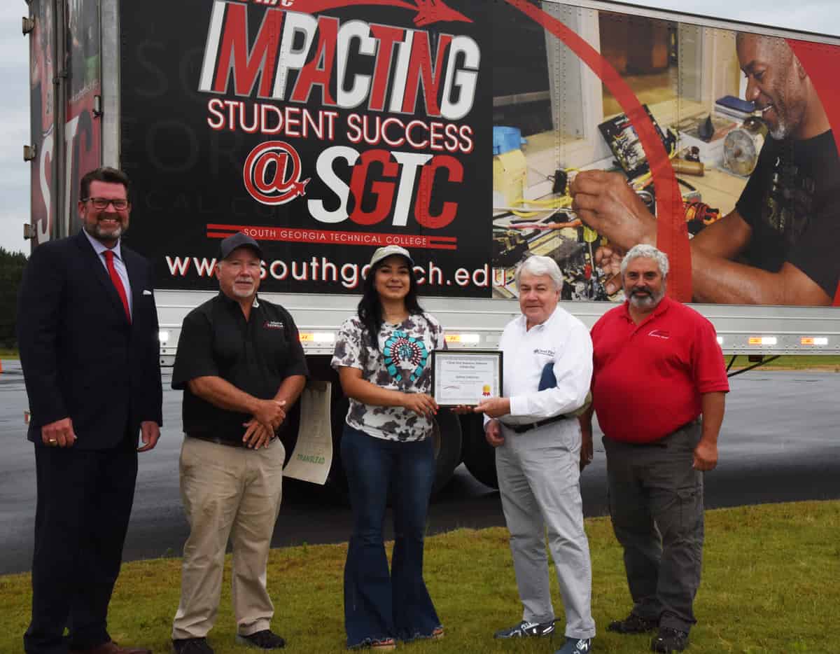 Shown above (l to r) are South Georgia Technical College President Dr. John Watford with SGTC CDL instructor Ken Hair, scholarship recipient Julissa Gutierrez with Client First Insurance’s Jody Wade making the presentation. Also shown is SGTC CDL Instructor Ken Coptsias.