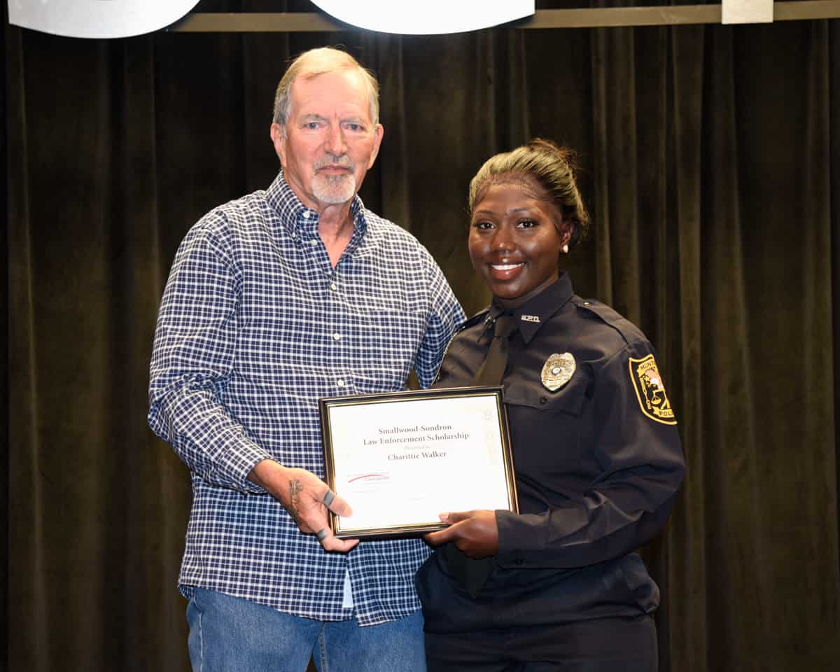 Lou Crouch who helped endow the Smallwood - Sondron Law Enforcement Academy Scholarship at South Georgia Technical College is shown above presenting the Smallwood – Sondron Scholarship award to Charittie Faith Walker.