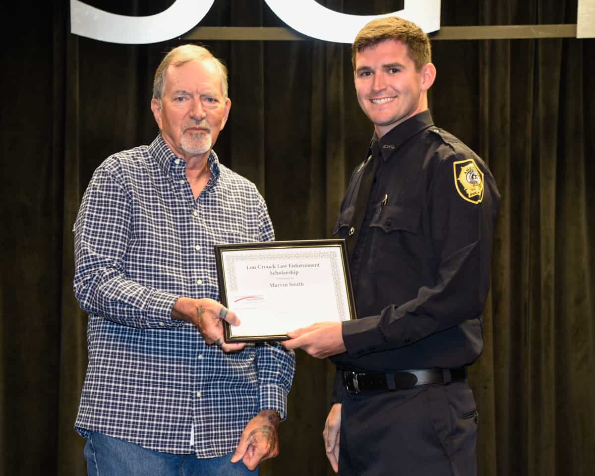 Marvin Chad Smith, IV, of the South Georgia Technical College Law Enforcement Academy Class 22-01 is shown above (right) receiving the SGTC Foundation Lou Crouch Law Enforcement Academy Scholarship award from Lou Crouch who endowed the scholarship.