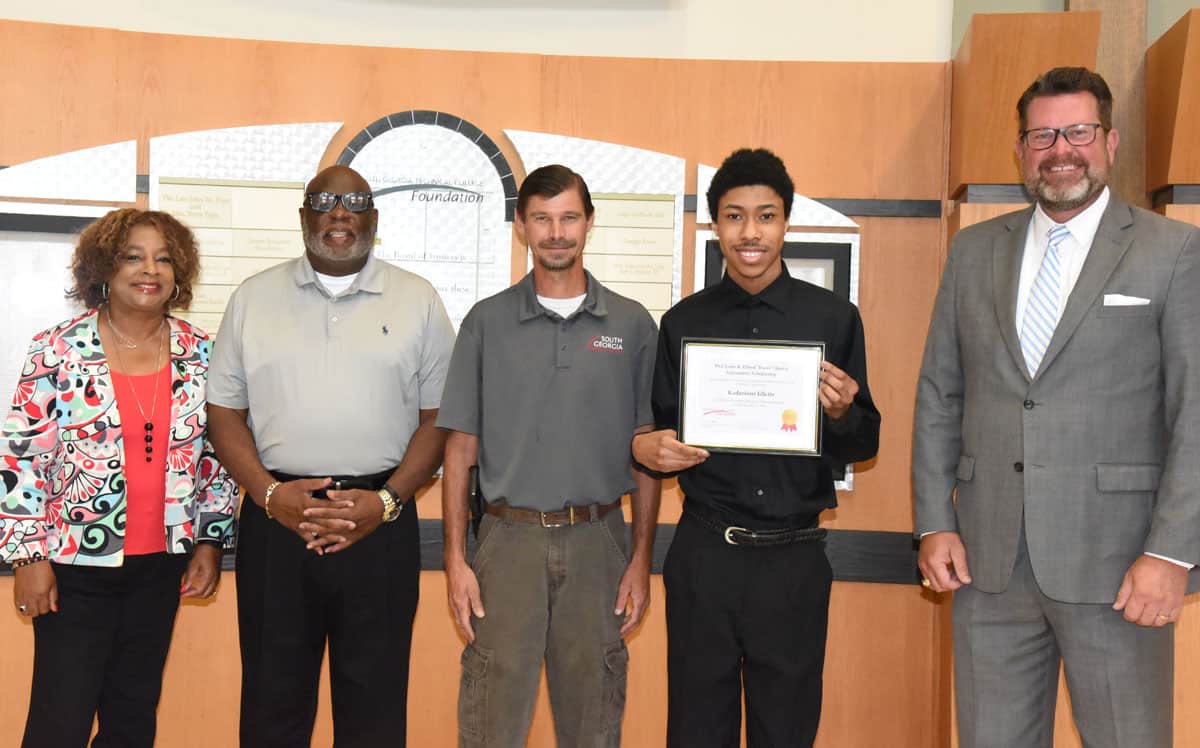 South Georgia Technical College President Dr. John Watford is shown above (right) along with Al Harris (l to r), Vickie Austin, SGTC Automotive Technology Instructor Brandon Dean, and Jones-Harris Scholarship recipient Kadarious Idlette. Not shown is SGTC Foundation executive director Su Ann Bird.