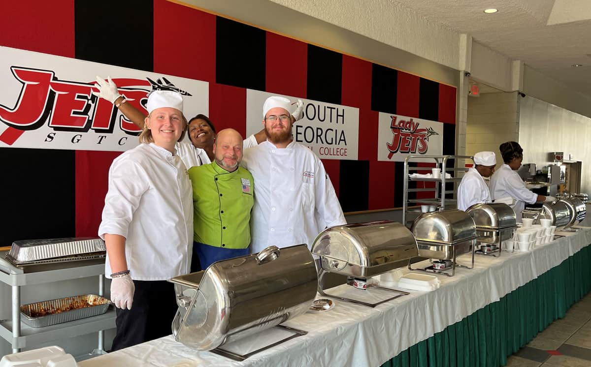SGTC Culinary Arts Instructor Chef Ludwig “Ricky” Watzlowick is shown above with several students getting ready for the Italian theme luncheon.