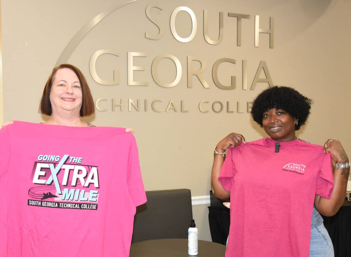 South Georgia Technical College Registrar Kari Bodrey is shown above with Sherri Hillman displaying the “Going the Extra Mile” t-shirts that the college presented to its students at the beginning of Fall Semester.