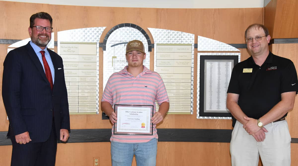 South Georgia Technical College President Dr. John Watford (left to right) is shown above with Mike Cochran Scholarship recipient Lawrence Starling and SGTC Aircraft Structural Technology Instructor Jason Wisham.