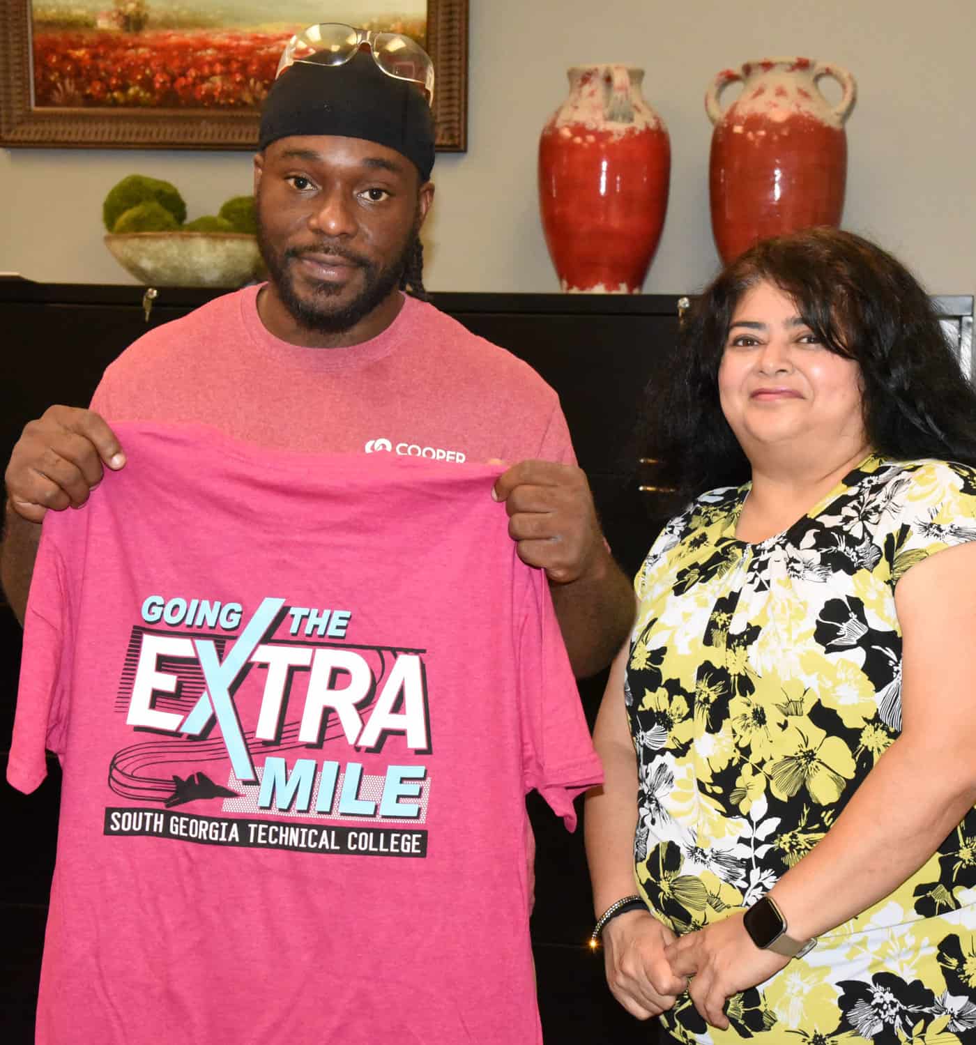 Shown above with Trinity Snelling is SGTC WIOA Coordinator Sandhya Muljibhai presenting him with a “Going the Extra Mile” t-shirt from South Georgia Technical College.