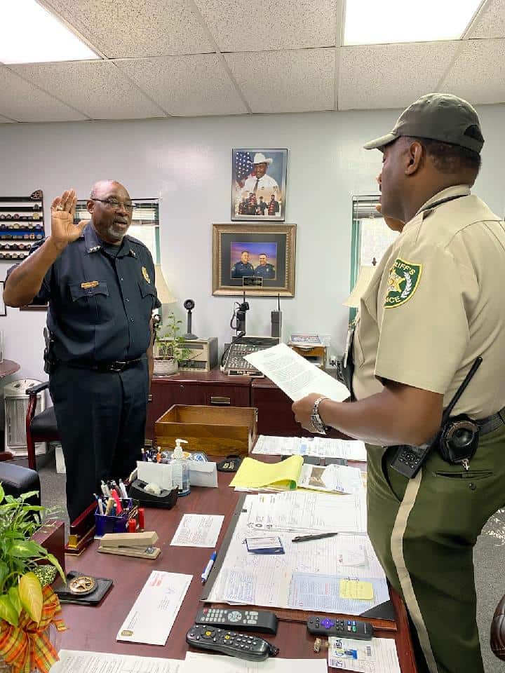 Sheriff Eric Bryant (right) is shown above conducting the swearing in ceremony for SGTC Director of Campus Safety and Police Chief Sammy Stone (left).