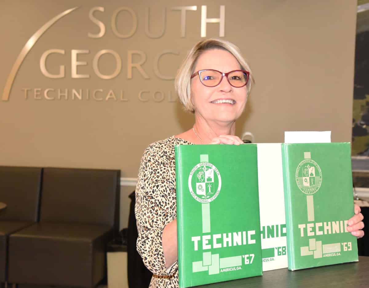 Terrie Smith is shown above with the 1967, 1968, and 1969 annuals from the South Georgia Tech Vocational School donated to SGTC by Linda Carll.