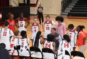 SGTC head coach James Frey is talking with his team during a time-out.