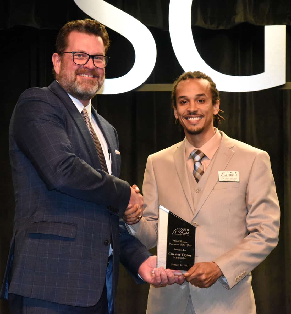 SGTC President Dr. John Watford (left) is shown above presenting Math Instructor Chester Taylor (right) with the SGTC Instructor of the Year award for 2023.