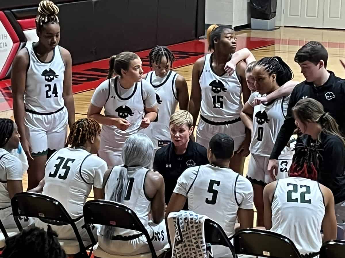 Shelton State Community College head coach Madonna Thompson is shown above talking with the Lady Bucs during a timeout in the upset over Eastern Florida.