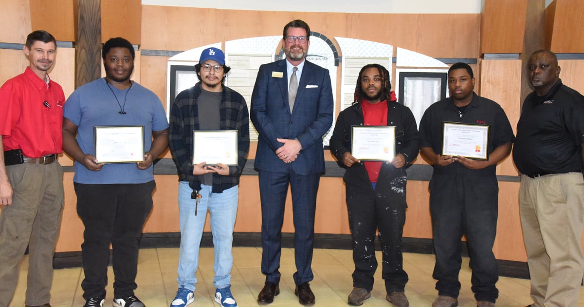 SGTC President Dr. John Watford (center) is shown above congratulating the four SGTC students who were presented with GADA scholarships recently by the SGTC Foundation. Shown (l to r) are SGTC Automotive Technology Instructor Brandon Dean with his scholarship students David Battle, Jr. and Jose Aguilar, Dr. Watford, and Auto Collision and Repair scholarship winners Brandon Ross and Traylon Blocker and their instructor Starlyn Sampson.