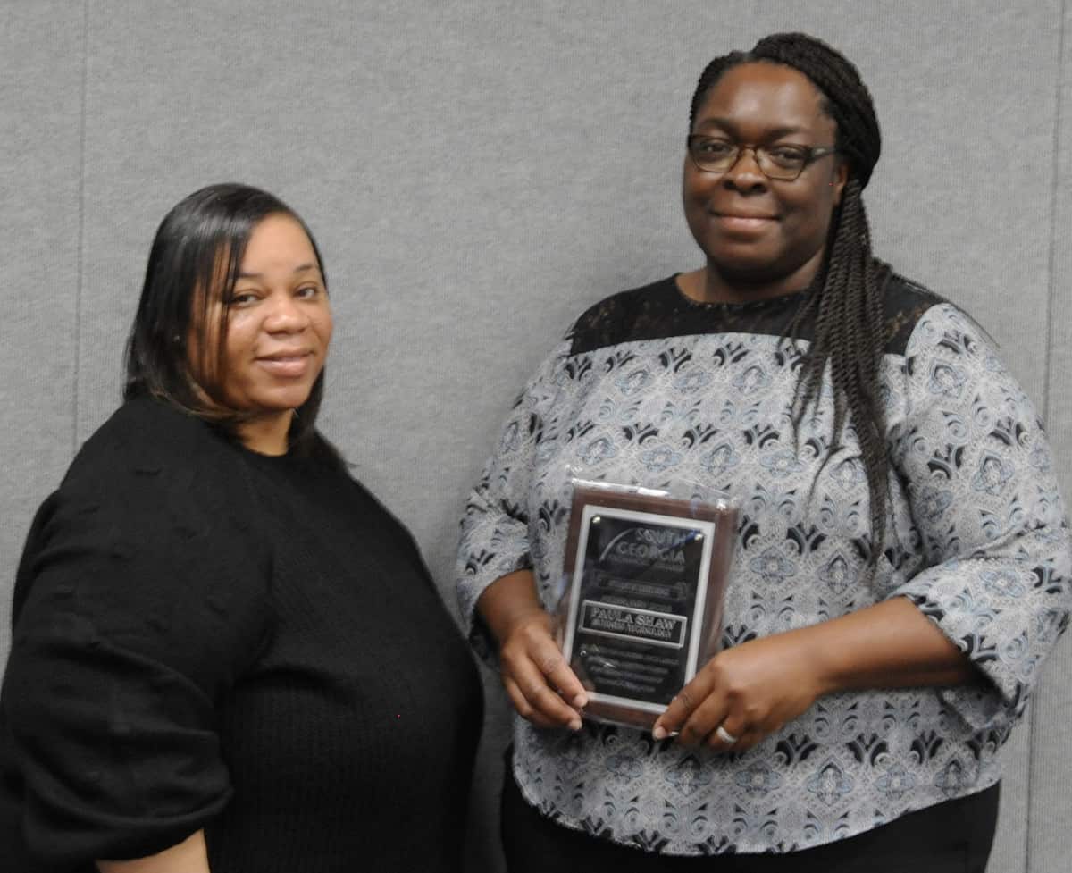 Pictured is Paula Shaw (right), the overall Student of Excellence winner for the SGTC Crisp County Center, with SGTC Business Technology instructor Nicole Turner.