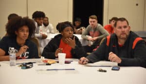 SGTC Head coach James Frey is shown above with assistant coaches Olivia Melvin and Ricca Jackson watching the NJCAA Division I Women’s National Tournament Selection Show with players and supporters Sunday night.