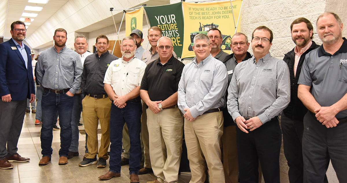 South Georgia Technical College President Dr. John Watford is shown above with Michael Pope, Ag Pro (sales); Bill Roberson, Ag Pro Division Pres. Jacksonville Fl.; David Frist, Dobbs Equip. Technical Trainer; Rory Brock, Service manager Cairo Ga; Max Jett, Flint Ag Turf Sylvester Ga; Jeremy Miller, Flint Ag Turf Americus, Ga.; Doug Eldridge, Lasseter Moultrie, Ga; Mike Kemmerer-Dobbs VP of Product Support, Atlanta Ga; John Golka, Dobbs Warranty Manager and Service Operations, Atlanta, Ga; Bert Bagley, Territory Customer support manager SE for Deere C/F; and Charles Lackey, Dobbs Service manager Albany, Ga. Also shown with the group are SGTC John Deere Instructors Matthew Burks and Wayne Peck.