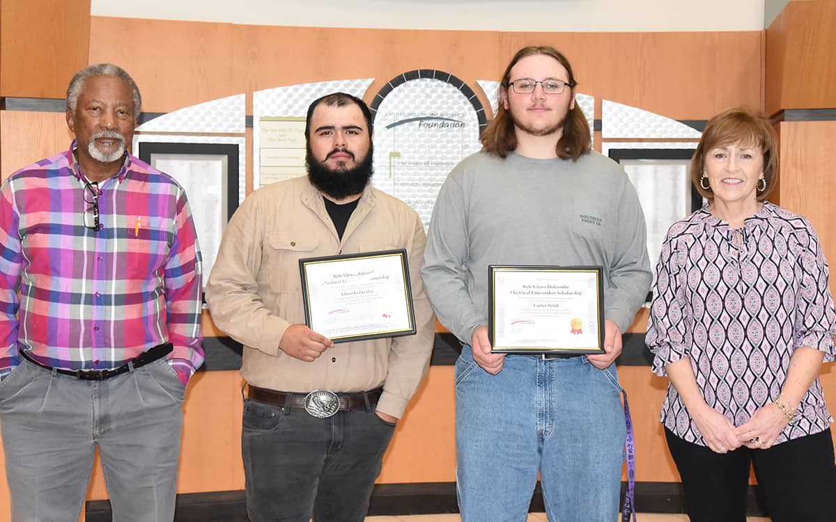 South Georgia Technical College Electrical Lineworker instructor Sidney Johnson is shown above with Eduardo Zavalza of Covington and Carter Petitt of Waynesboro, who both received the SGTC Foundation Kyle Glenn Holcombe Electrical Lineworker scholarship recipient. SGTC Economic Development Assistant and Partnership Coordinator Tami Blount is also shown with the two scholarship winners during the scholarship presentation.